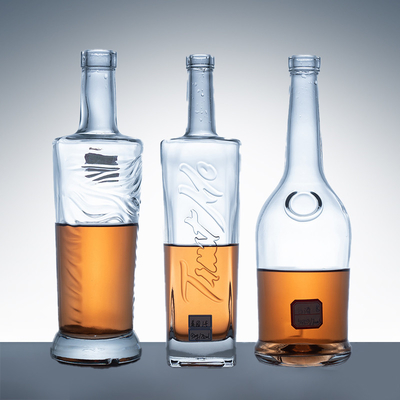 Muestra de botellas de vino de vidrio vacío de 1 litro con tapa de 300 ml y 750 ml.