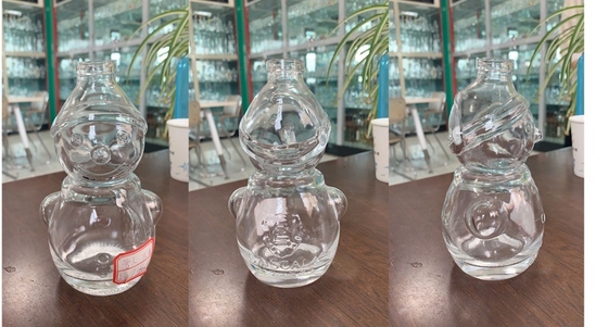 Botella de whisky transparente de cristal de sílex en forma de muñeco de nieve con manejo de superficie decal