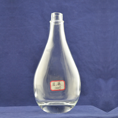 Botella de vidrio de estampado en caliente de proceso profundo para vino en forma de gota de agua