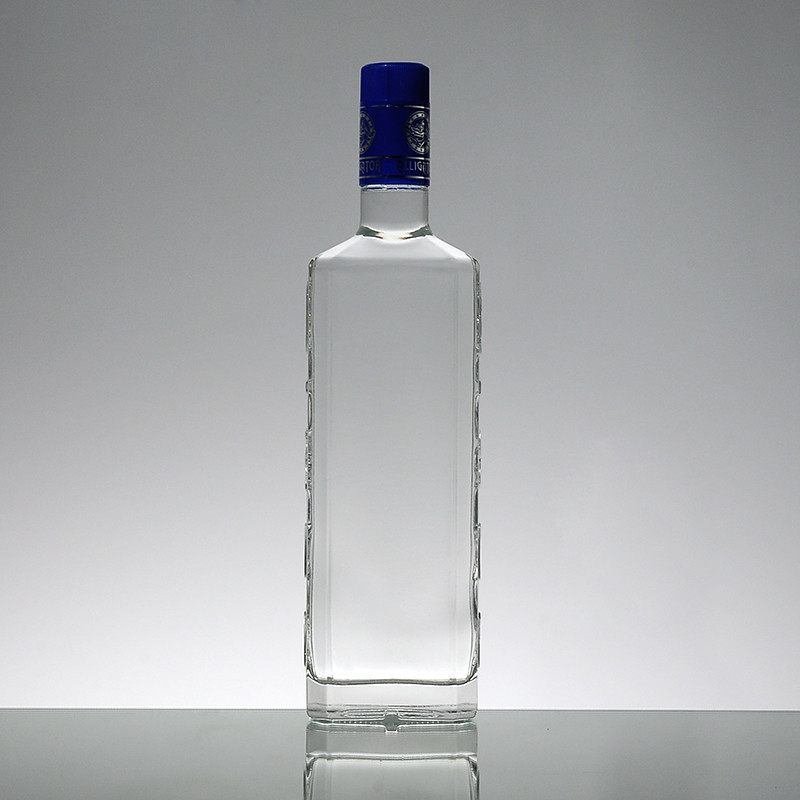 Superficie de estampación en caliente 1L botella de whisky de súper vidrio hecha de material blanco cristalino